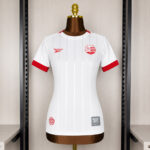Camisa CNC Away Versão Torcedor Feminina 2026/27 Alvi-Rubro Reebok